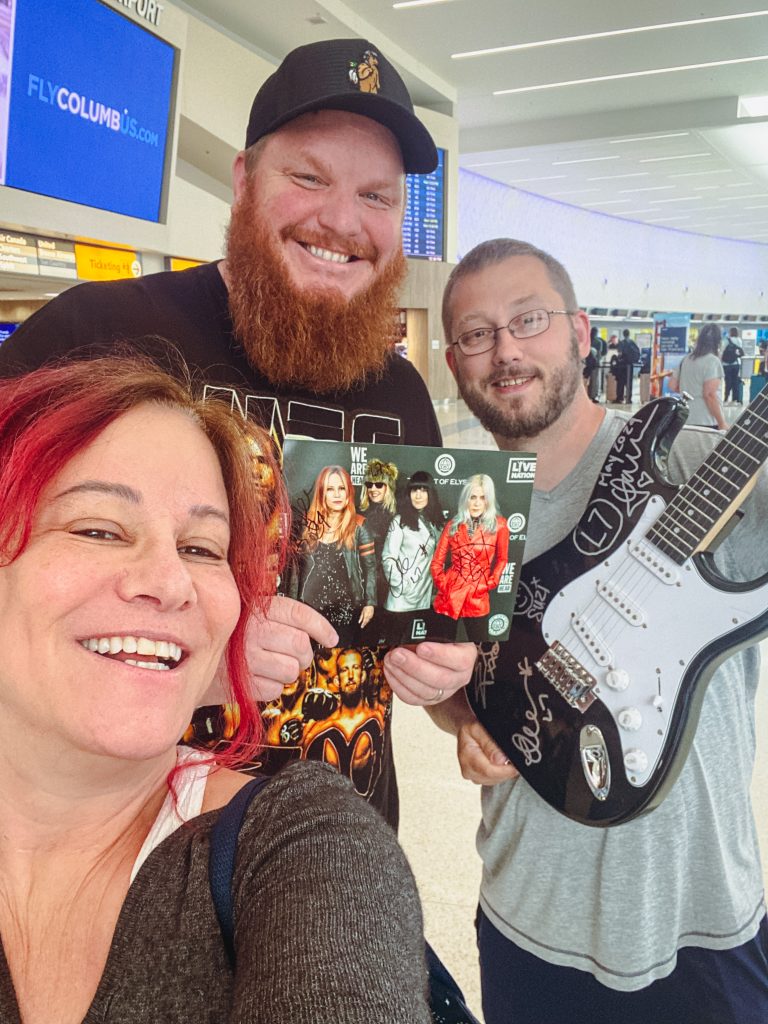 Jennifer Finch with L7 fans 20 24 Columbus Airport