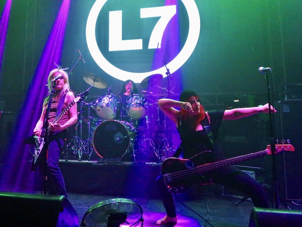 Donita Sparks, Dee Plakas, and Jennifer Finch performing live on stage